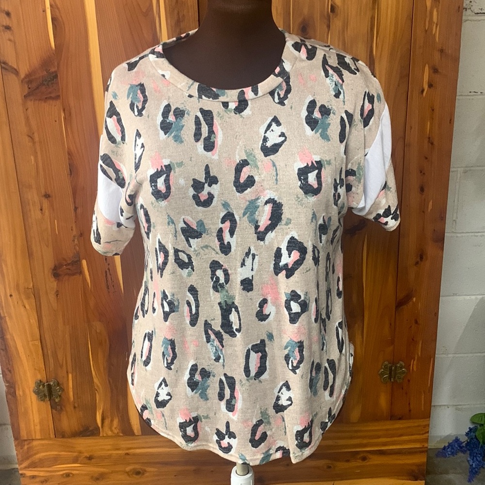Cheetah print short sleeve shirt.